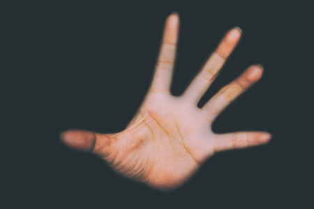 hand of Fear woman being abuse on ground with man on her body and holding her hairs ( abuse concept, sexual abuse)with shadow edgeの写真素材