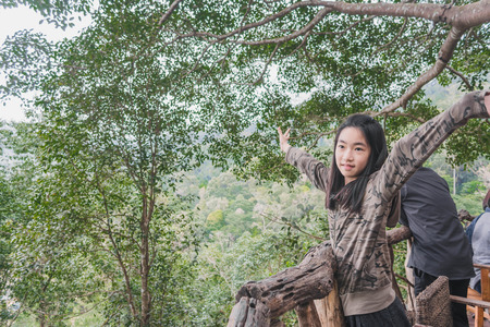 kids standing and enjoy freshness and view of natural in the mountains.の写真素材