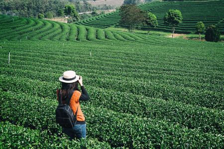 Photograher holding DSLR Camera for shoot photo in Chiangmai ,Thailandの写真素材