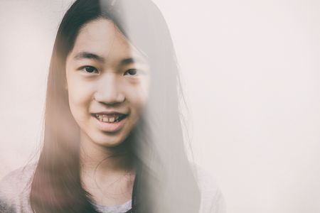 cute happy girl smiling on whiteの写真素材