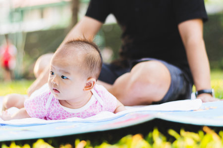 father parenting baby on parkの写真素材