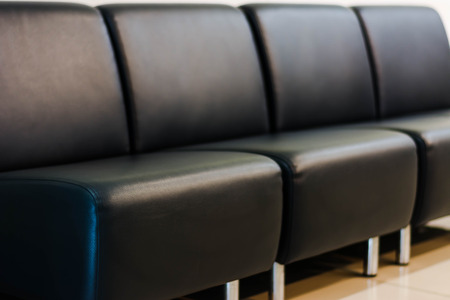 empty modern black leather sofa in roomの写真素材