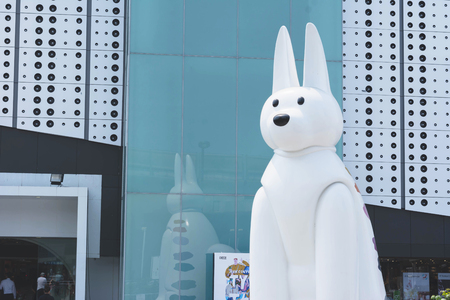 BANGKOK, THAILAND, FEBRUARY 28, 2017, dog statue in front of New MBK Shopping, the one of the most popular shopping malls in Bangkok.のeditorial素材