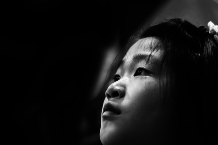 sadness and depress girl, absent minded, Child Abuse in white toneの写真素材