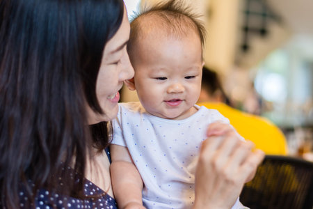 sweet asian happy baby playing with aunt