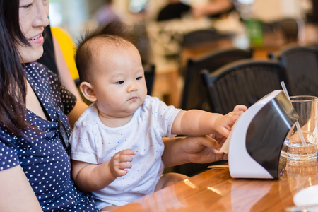 sweet asian happy baby playing with auntの写真素材