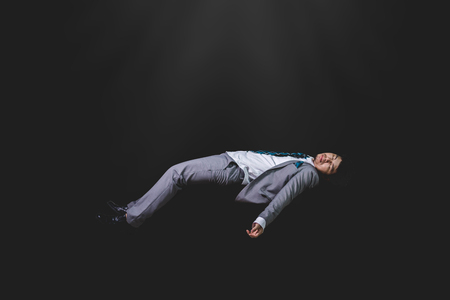 falling and screaming businessman in formal wear の写真素材