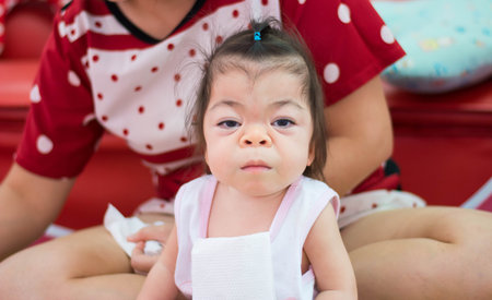 sweet Asian baby ready for her dinner