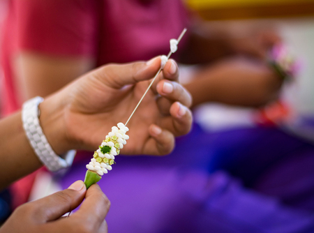making floating basket by banana leaf, krathong for Loy Kratong Festival, river goddess worship ceremony, full moon festival,  the famous festival of Thailandの写真素材