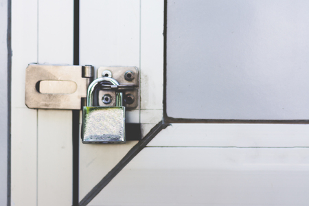 key locked hanging on the doorの写真素材