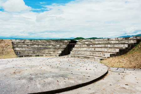 old abandoned stadium against cloudy sky backgroundの写真素材