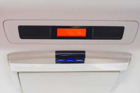 Car light panel on the top with buttons, air conditional box.