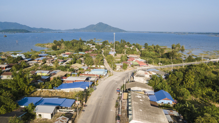Aerial view of countryside village with mountain and lake background の写真素材