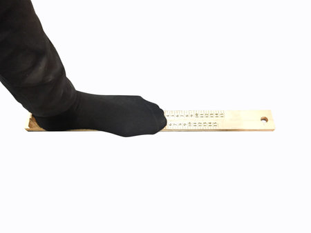 measure shoe size isolated on white backgroundの写真素材