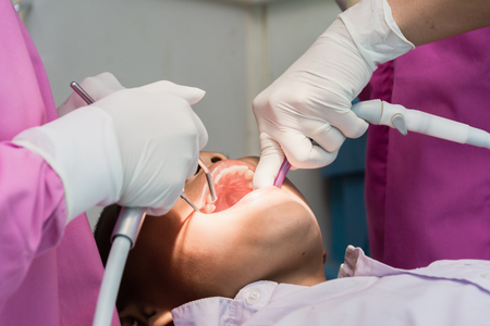 Nakhonsawan, Thailand : 2 March 2018, Dentist and Dentist assistant Checking teeth for children at sanitation.のeditorial素材
