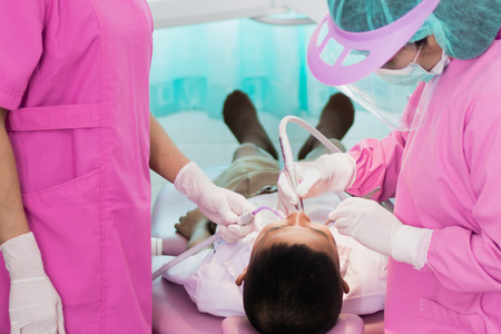 Nakhonsawan, Thailand : 2 March 2018, Dentist and Dentist assistant Checking teeth for children at sanitation.のeditorial素材