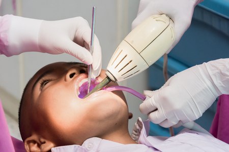 Nakhonsawan, Thailand : 2 March 2018, Dentist and Dentist assistant Checking teeth for children at sanitation.のeditorial素材