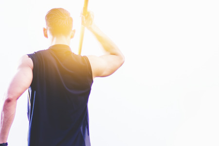 sportsman warming up and practicing javelin throw in yardの写真素材
