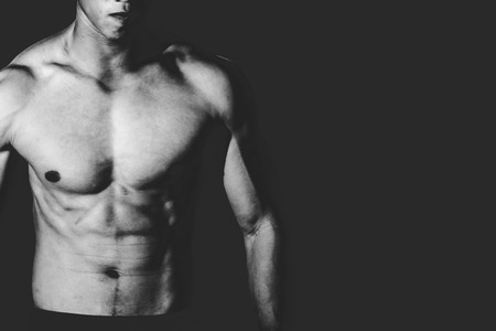 Strong Athletic Man showing muscel in white toneの写真素材