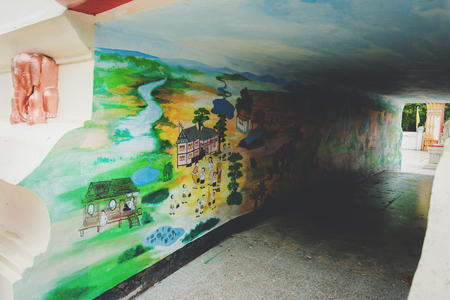Nakhonsan, THAILAND â May 29, 2017 : mural paintings at wall of tunnel in Temple, public open for people to see and take a photo.のeditorial素材