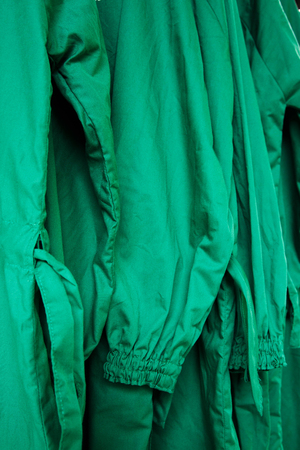agriculture coat hanging on hanger in control fieldの写真素材