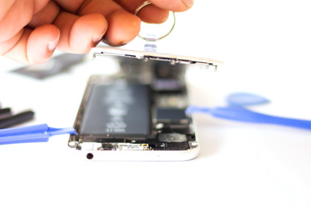 Close-up Of Repairing Cellphone,open the cover of the phone