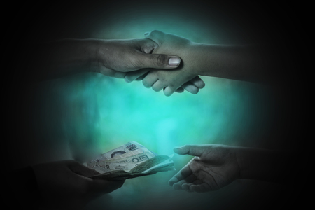 Man handing money for buying child, Human trafficking conceptの写真素材