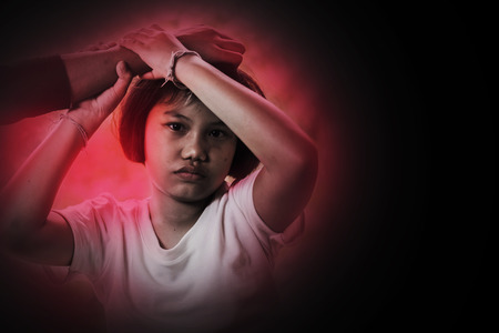 Hand of Man on Girl's head, pulling her hair, Child abuse conceptの写真素材