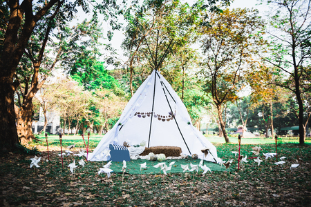 small teepee tent outdoor for enjoy natural outside in forestの写真素材