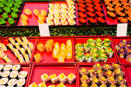 Japanese assorted sushi food on tray selling on street marketの写真素材