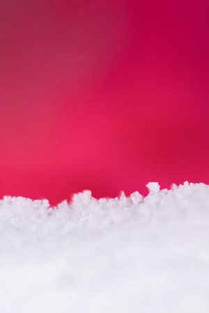 Blurry on ice crystals frozen in refrigerator on red backgroundの写真素材