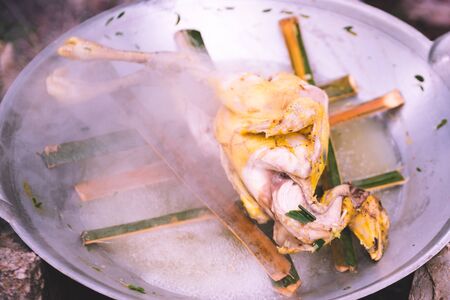 steaming chicken in frying pan, cooking conceptの写真素材