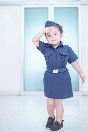 A Cute and lovely Asian baby girl in formal uniform dressの写真素材