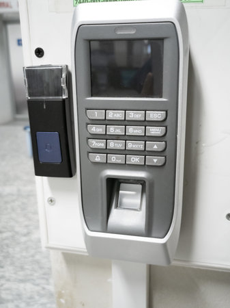 Finger scanner on the wall in the building