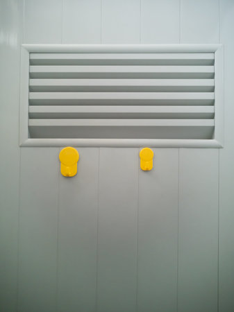 yellow plastic wall hook hangers on door