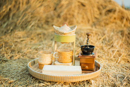 Small retro coffee drip set with rice stall backgroundの写真素材