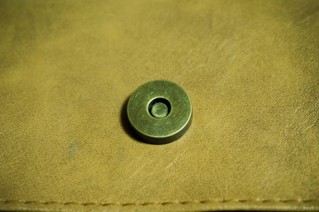Button on leatherwork
