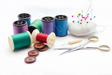 collection of sewing tools and supplies on a white background