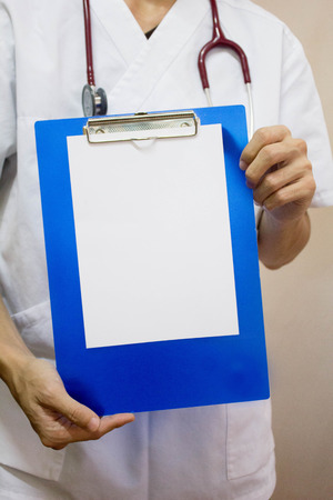 Medical record with stethoscopeの写真素材