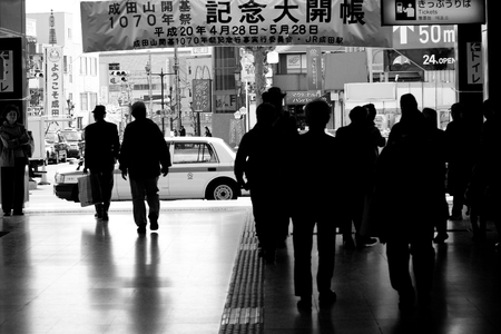 Tokyo, Japan - April 1, 2008: Entrance area of metro railway station in Tokyo. Black and white.のeditorial素材