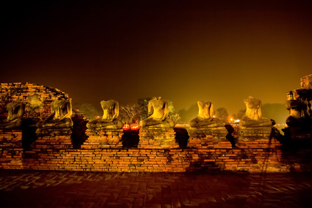 Headless buddha statues at Chai Watthanaram Temple in the city of Ayutthaya Historical Park, Thailand. It is one of Ayutthaya's best known temples and a major tourist attraction.の写真素材