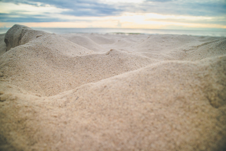 Close up of sand mountains on the beach in the morning.の写真素材