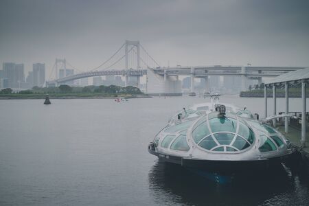 Asakusa, Japan - April 23, 2018: Tokyo Cruise Ship (Hotaluna) parking at Odaiba pier in a cloudy day.のeditorial素材