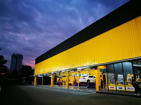 Bangkok / Thailand - December 30, 2016: White car  in maintenance in garage service station. Car service, repair, maintenance concept.のeditorial素材