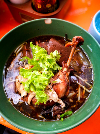 Duck noodles with duck leg and soup, one of Thailand street food.の写真素材