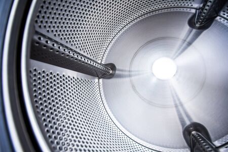 Close up photo of inside washing machine drum.の写真素材