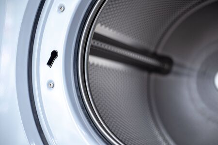 Close up photo of inside washing machine drum.の写真素材