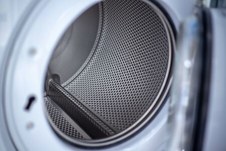 Close up photo of inside washing machine drum.の写真素材