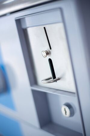 Coin slot of coin laundry vending machine.の写真素材