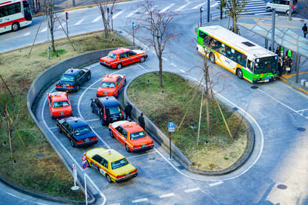 Tokyo / Japan - March 16, 2019: Tokyo taxi parking at taxi point with a bus stop. Top view from Tokyo Skytree.のeditorial素材